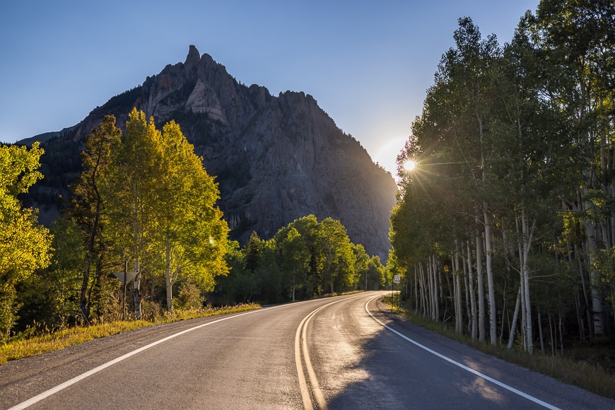 Mountain road with solar flare