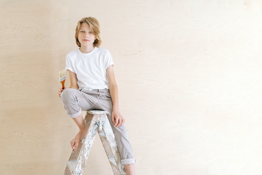 Boy on stepladder