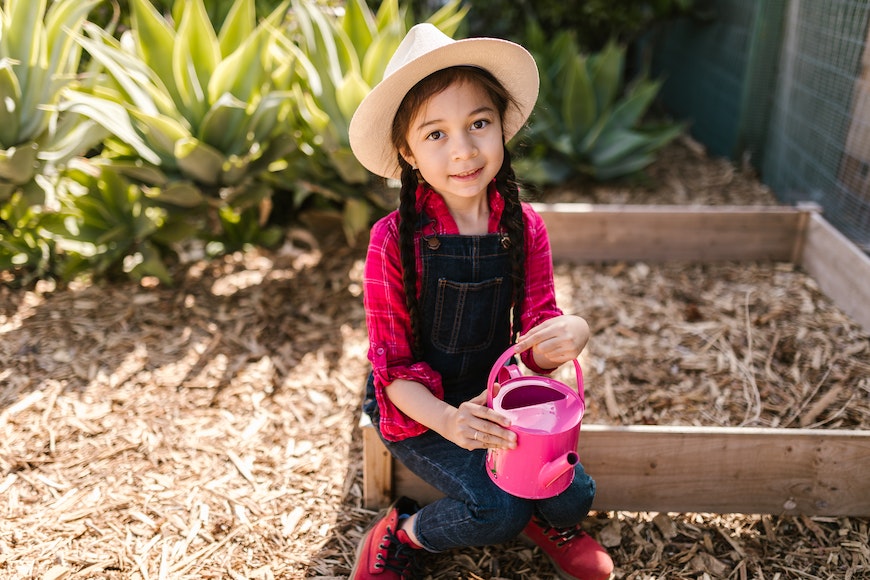 Girl watering garden