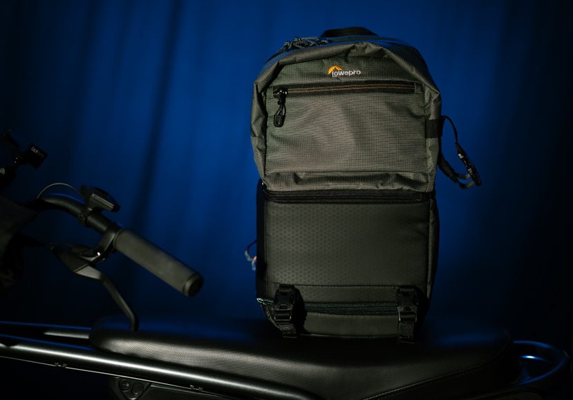 The Lowepro Slingshot SL 250 AW III sitting atop an electric bike.