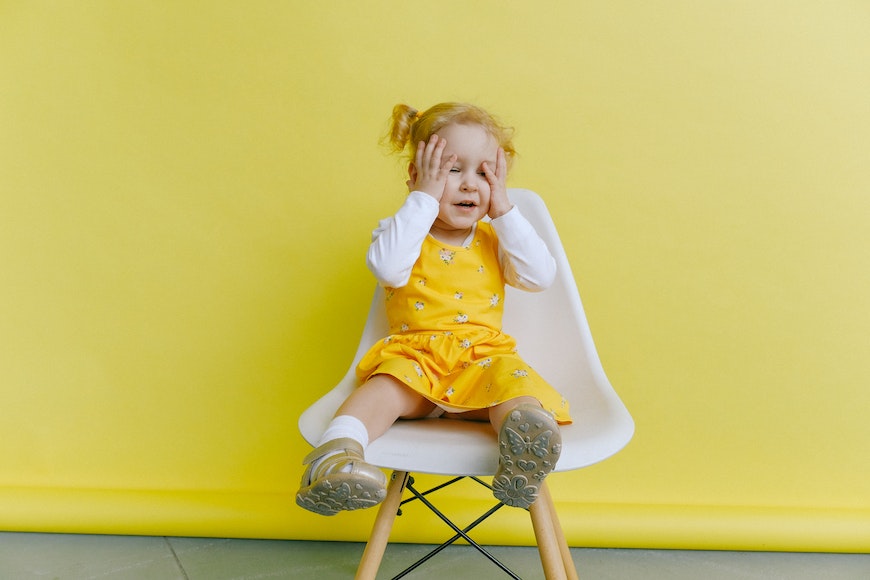 Little girl on chair