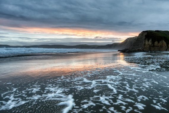 A sunset reflected int he water at Point Reyes national Seashore