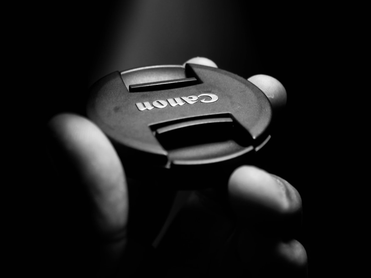 rishabh-sharma-VX3CT15N320-unsplash photo of canon lens cap