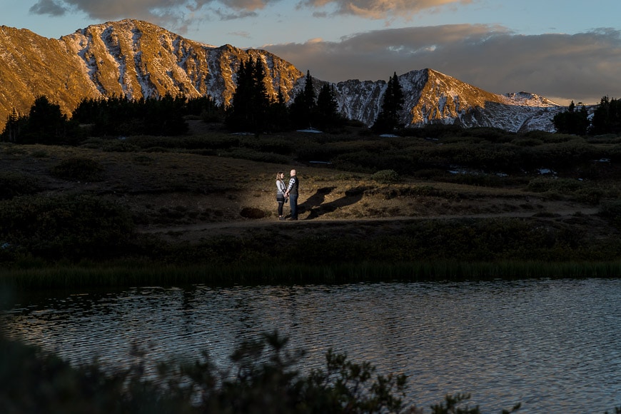 Couple in landscape with lake