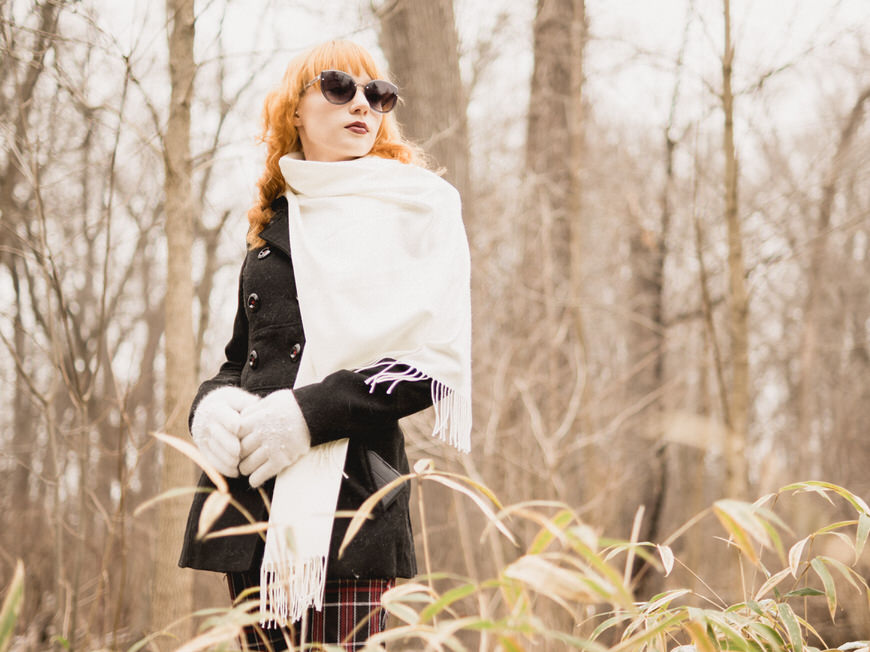 Girl with sunglasses and winter gloves